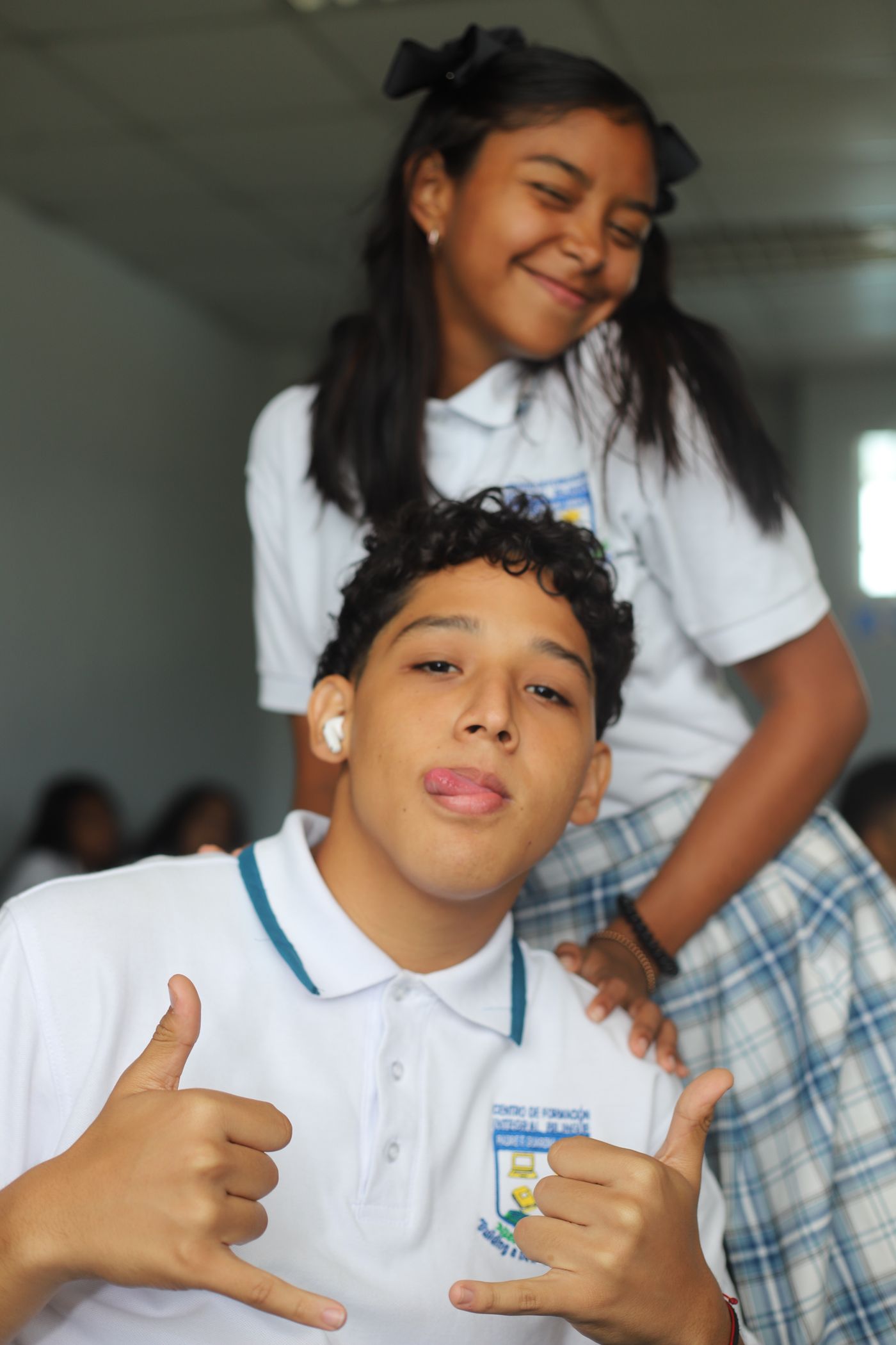 Two students smiling during a Latinos Unidos activity