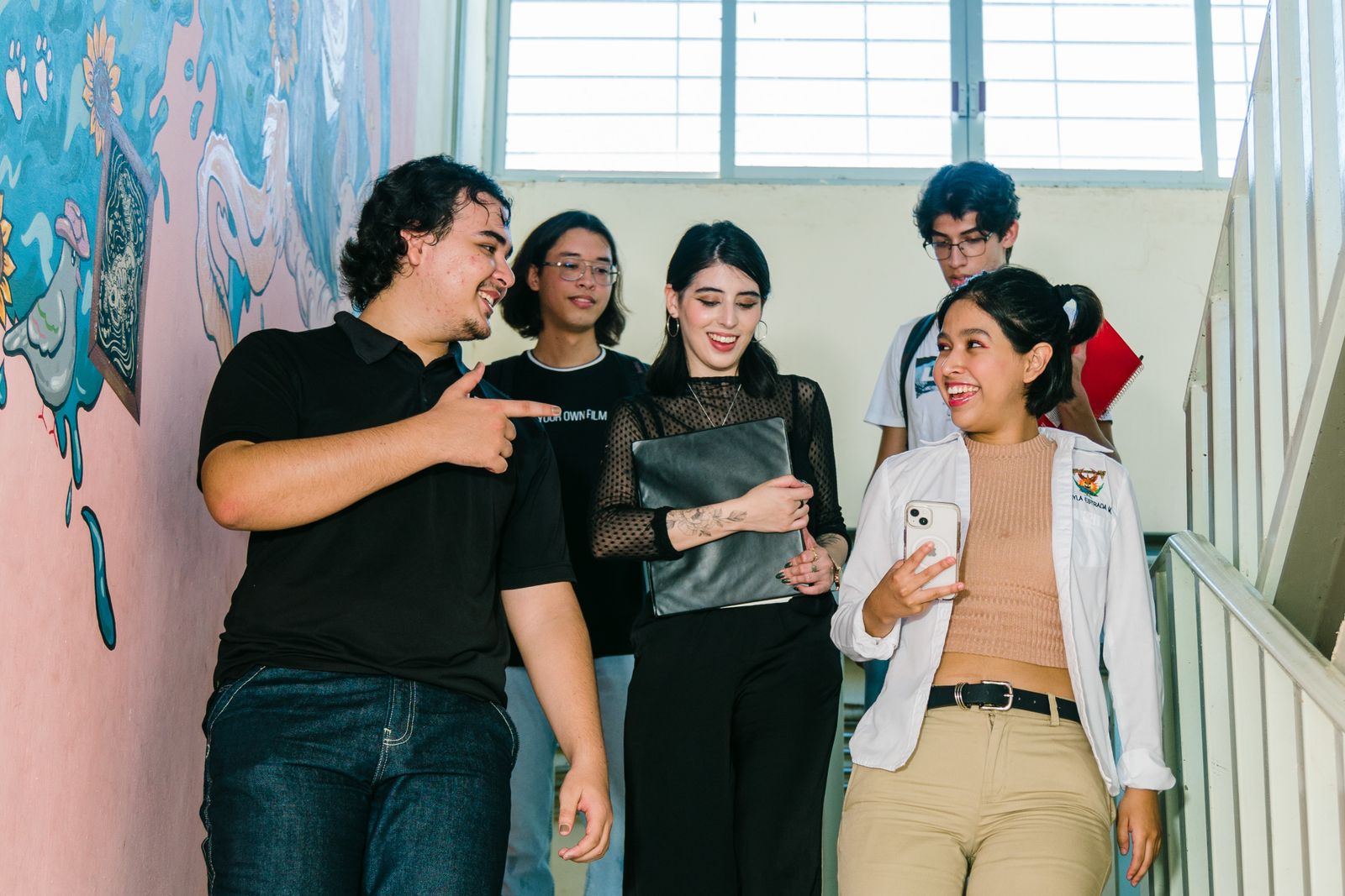 Latinos Unidos students talking together after a club meeting